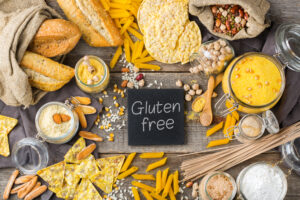 Healthy eating, dieting, balanced food concept. Assortment of gluten free food and flour, almond, corn, rice on a wooden table. 